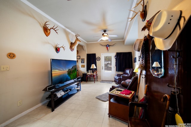 living room featuring ceiling fan and crown molding