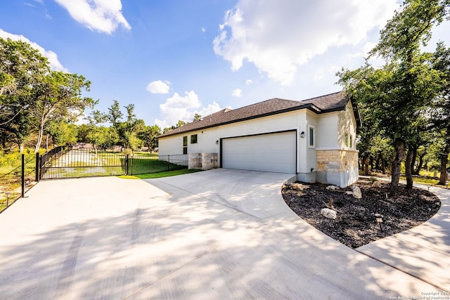 view of home's exterior featuring a garage and a lawn