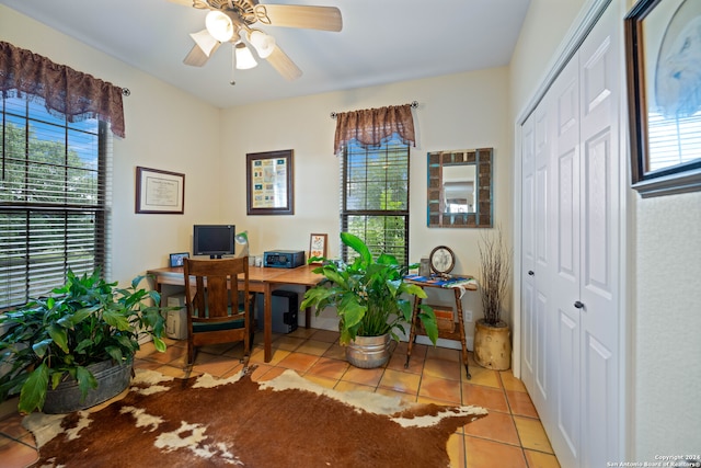 tiled home office with ceiling fan and a wealth of natural light