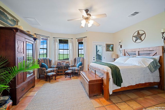 tiled bedroom with ceiling fan