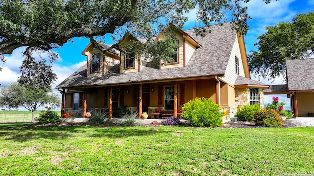 view of front of home with a front lawn and a porch