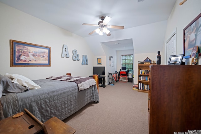 bedroom with vaulted ceiling, ceiling fan, and light colored carpet