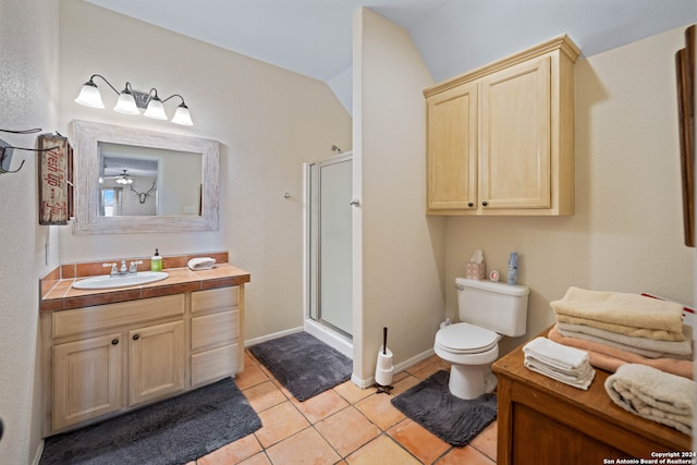 bathroom with vanity, lofted ceiling, a shower with door, toilet, and tile patterned floors