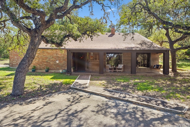 back of property featuring a patio area