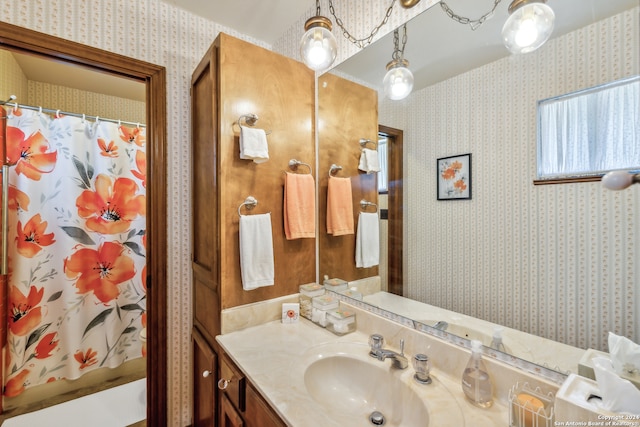 bathroom featuring shower / bath combination with curtain and vanity