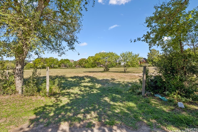 view of yard with a rural view