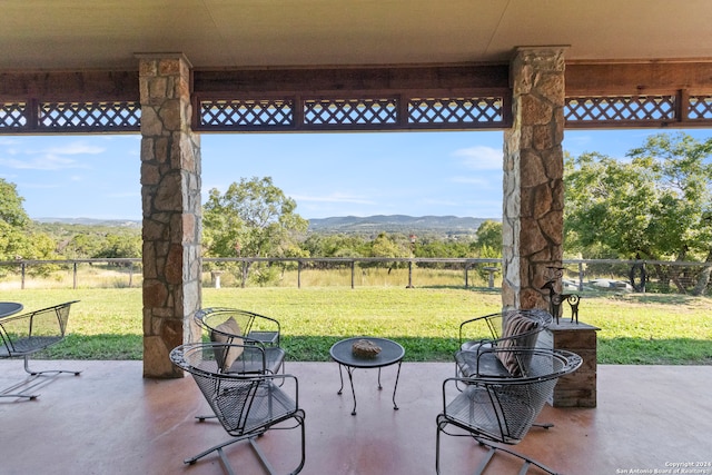 view of patio / terrace with a mountain view