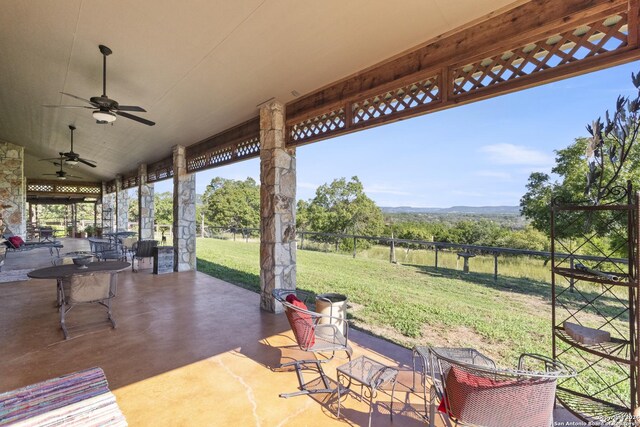 view of patio / terrace featuring ceiling fan