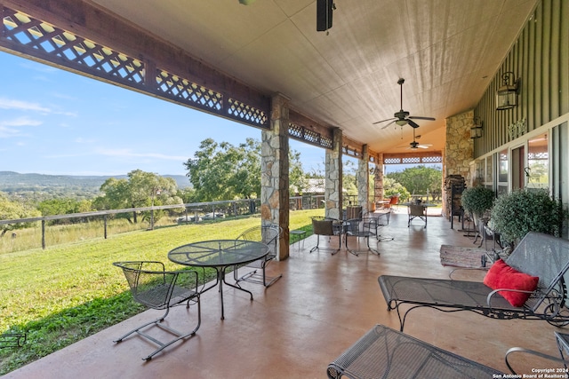 view of patio featuring ceiling fan