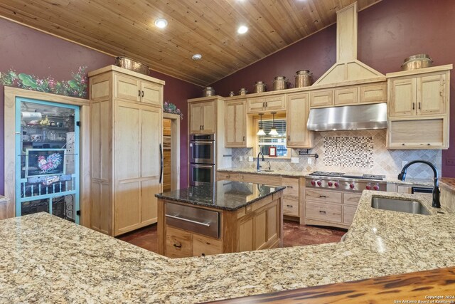 kitchen featuring light brown cabinetry and light stone countertops