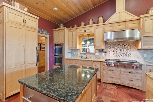 kitchen with light brown cabinets, stainless steel appliances, sink, and a center island