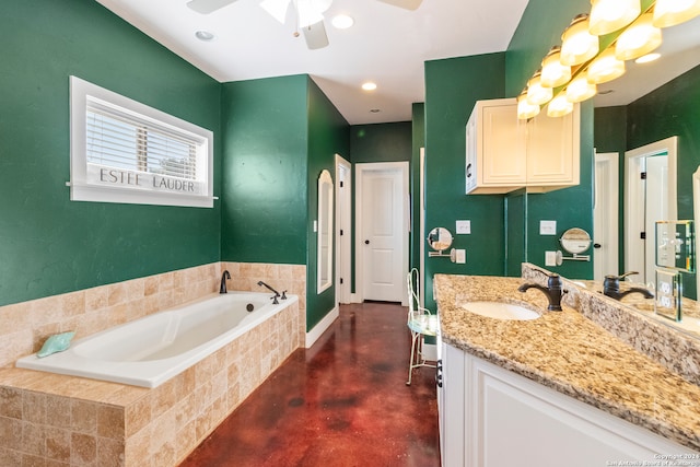 bathroom with tiled tub, vanity, concrete flooring, and ceiling fan