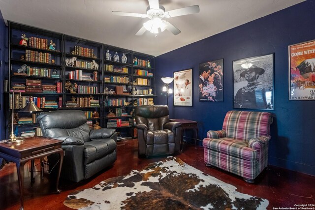 living area with ceiling fan