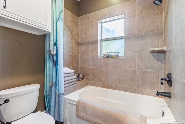 bathroom featuring toilet and shower / bath combo