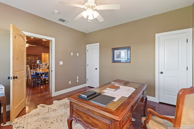 office featuring ceiling fan, vaulted ceiling, and dark hardwood / wood-style flooring