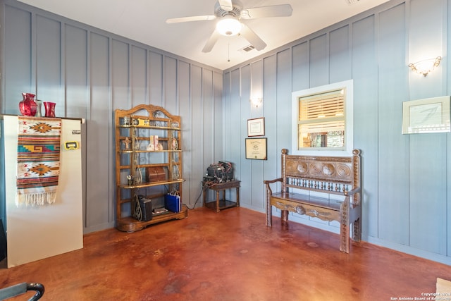 miscellaneous room featuring ceiling fan and concrete floors