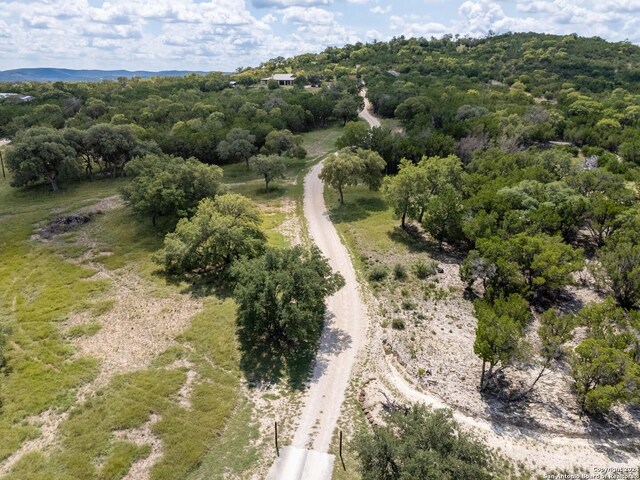 birds eye view of property with a rural view