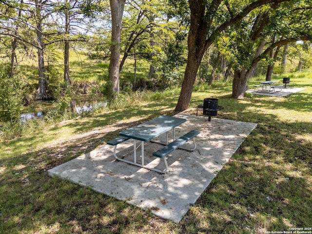 view of patio featuring a water view