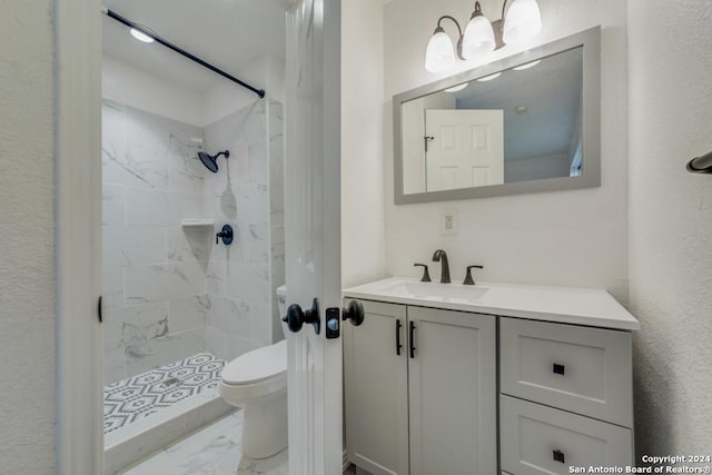 bathroom with vanity, toilet, a chandelier, a shower stall, and marble finish floor