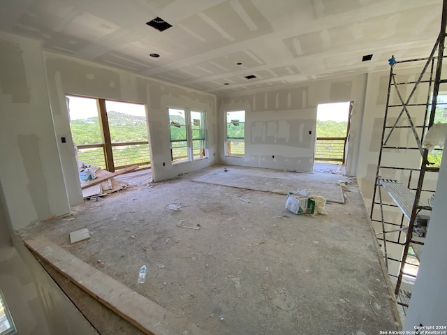 unfurnished living room featuring plenty of natural light