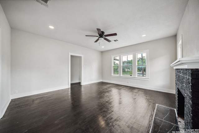 unfurnished living room with ceiling fan, dark hardwood / wood-style flooring, and a high end fireplace