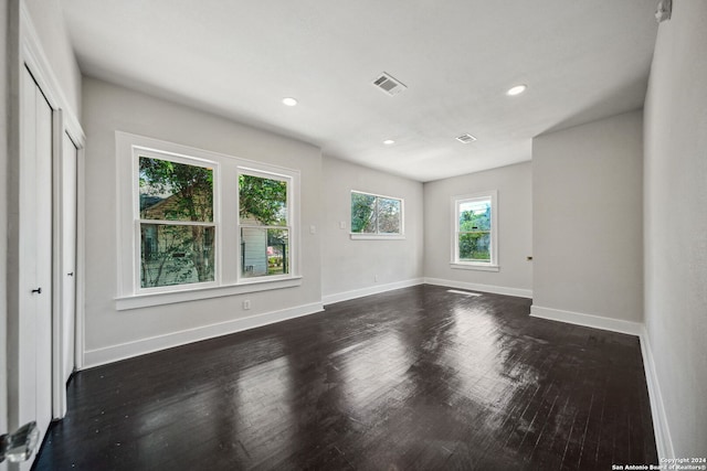 empty room featuring dark hardwood / wood-style flooring