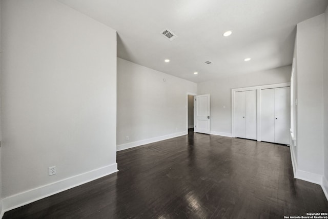 spare room featuring dark hardwood / wood-style floors