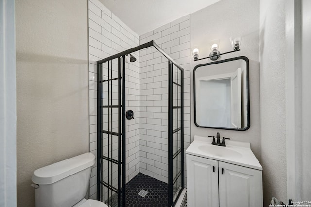 bathroom featuring vanity, toilet, and an enclosed shower