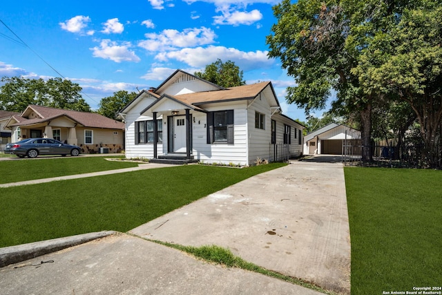 bungalow-style house with a front yard and a carport