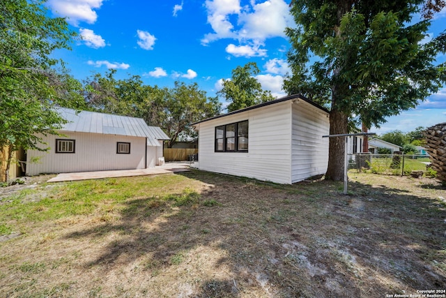 rear view of house with a patio