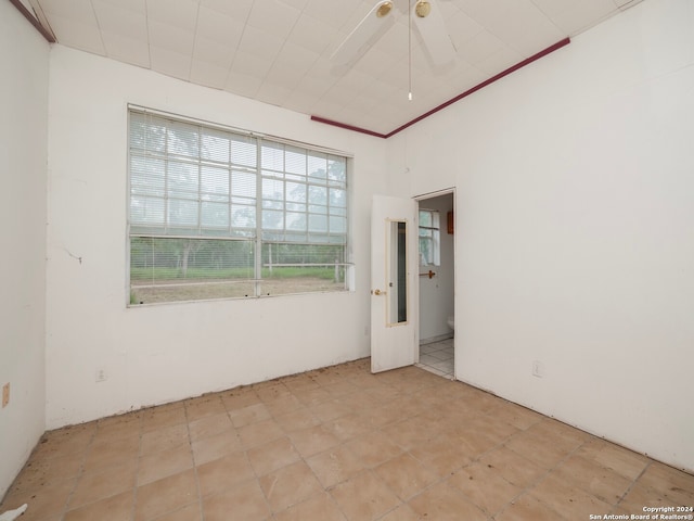 empty room featuring crown molding