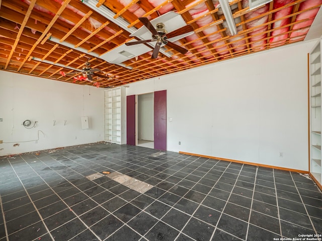 interior space with ceiling fan