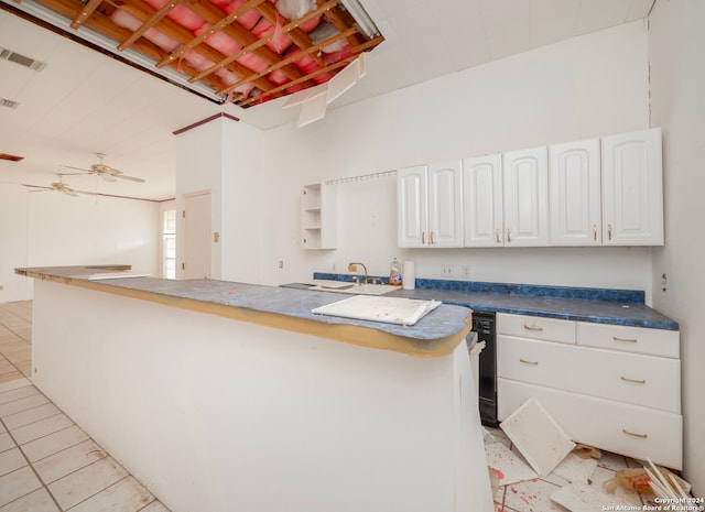 kitchen featuring white cabinets and light tile patterned flooring