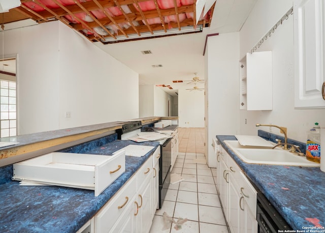 kitchen featuring black / electric stove, light tile patterned flooring, white cabinets, ceiling fan, and sink