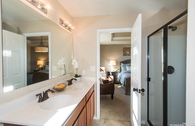 bathroom with walk in shower and vanity