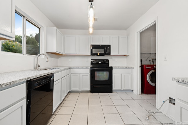 kitchen with decorative light fixtures, sink, white cabinetry, and black appliances