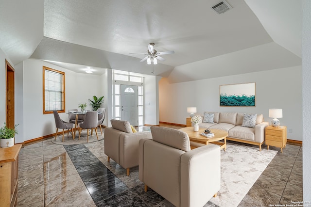 living room featuring vaulted ceiling and ceiling fan