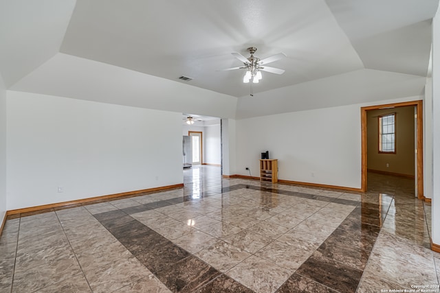 spare room featuring lofted ceiling and ceiling fan