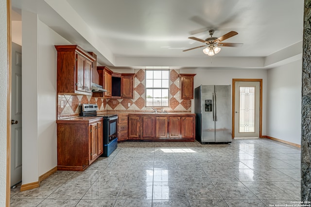 kitchen with decorative backsplash, sink, ceiling fan, and stainless steel appliances