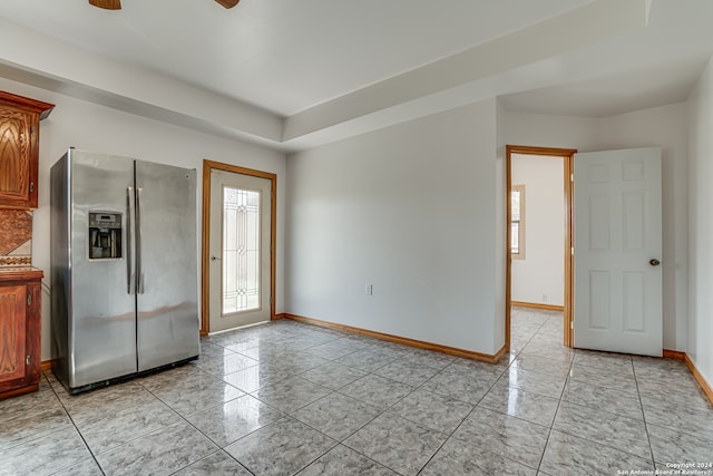 interior space featuring stainless steel fridge and ceiling fan