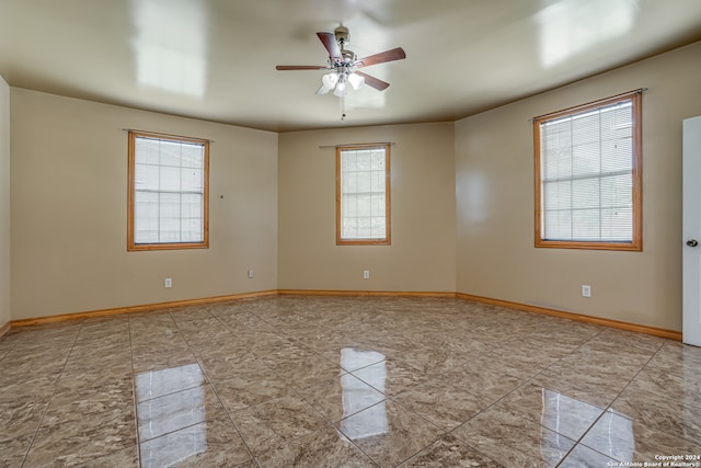 empty room featuring ceiling fan