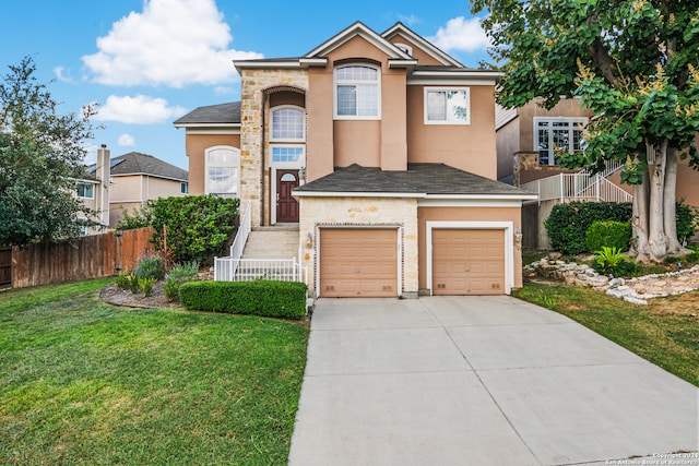 front of property featuring a garage and a front lawn