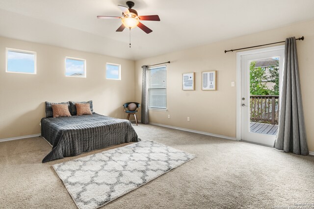 carpeted bedroom featuring access to outside and ceiling fan