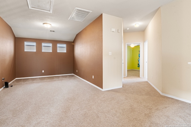 spare room with light colored carpet