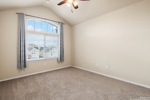 unfurnished room featuring carpet, lofted ceiling, and ceiling fan