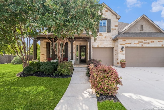 view of front facade featuring a front lawn and a garage