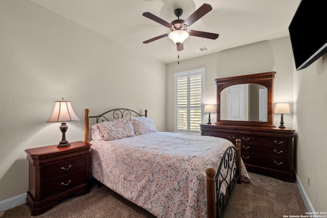 bedroom with ceiling fan and carpet flooring