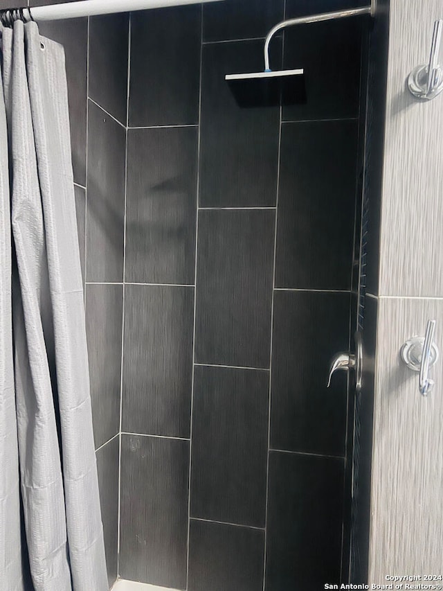 bathroom with a shower with shower curtain