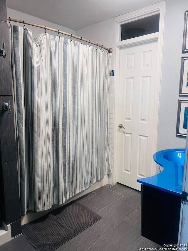 bathroom with vanity and curtained shower