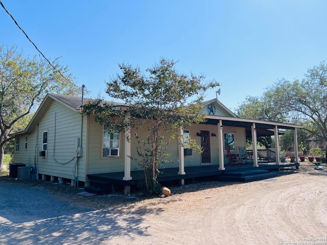 view of front of property featuring central AC and a porch